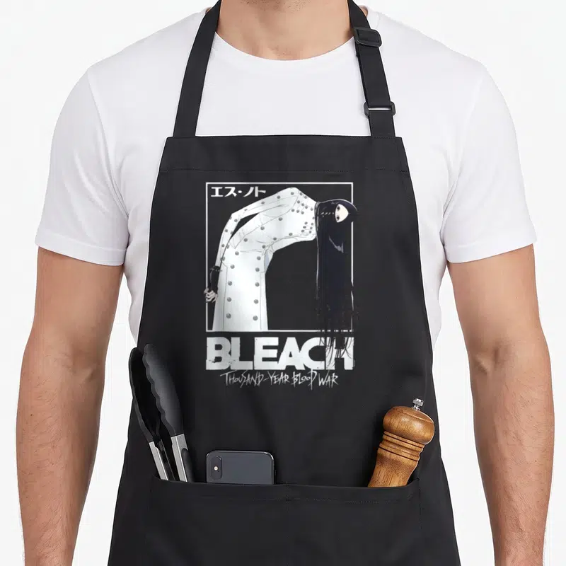 Tablier de cuisine noir avec illustration d'Est en tenue blanche et texte Bleach Thousand Year Blood War.