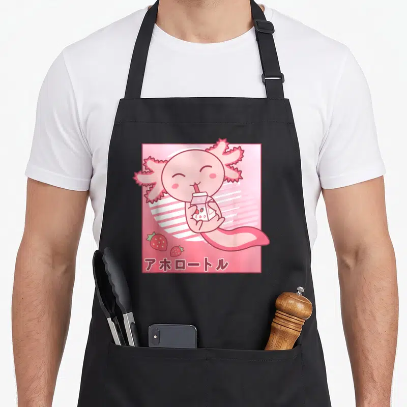 Tablier de cuisine noir avec illustration d'un axolotl rose buvant du lait de fraise style kawaii rétro.