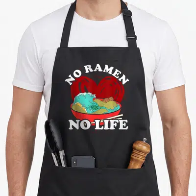 Tablier de cuisine noir avec un bol de ramen, un grand cœur rouge et le texte No Ramen No Life imprimé en blanc.