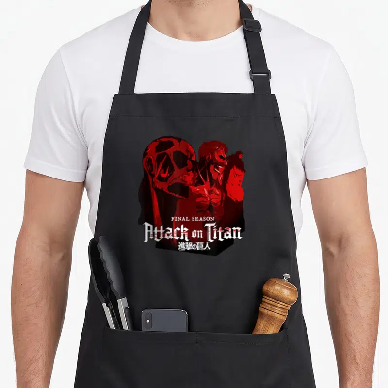 Tablier de cuisine noir avec illustration rouge des Titans et logo Attack on Titan Final Season.