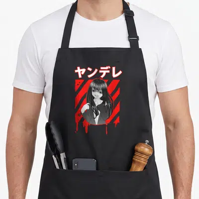 Tablier de cuisine noir avec illustration yandere et texte japonais redoutable