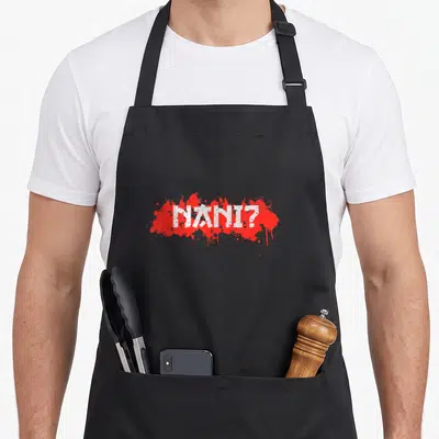Tablier de cuisine noir avec l'inscription Nani. en blanc sur fond d'éclaboussure rouge vif.