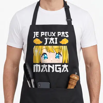 Tablier de cuisine noir avec illustration d'otaku aux yeux bleus et texte Je peux pas j'ai Manga en blanc.