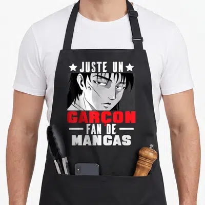 Tablier de cuisine noir avec portrait manga, texte Juste un Garçon Fan de Mangas en blanc et rouge.