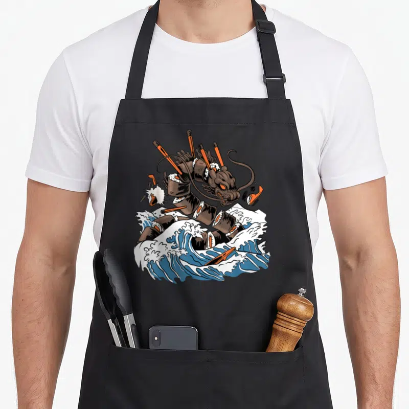 Tablier de cuisine noir avec illustration d'un dragon sushi monstre sur des vagues japonaises.
