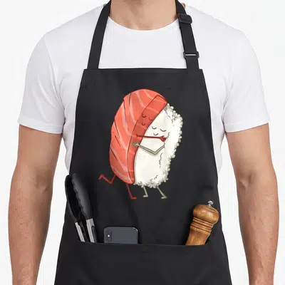Tablier de cuisine noir avec illustration d'un sushi kawaii otaku weeb aux couleurs vives et au design mignon.