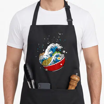 Tablier de cuisine noir avec illustration d'un bol à nouilles japonais et d'une superbe vague rétro jaillissante.
