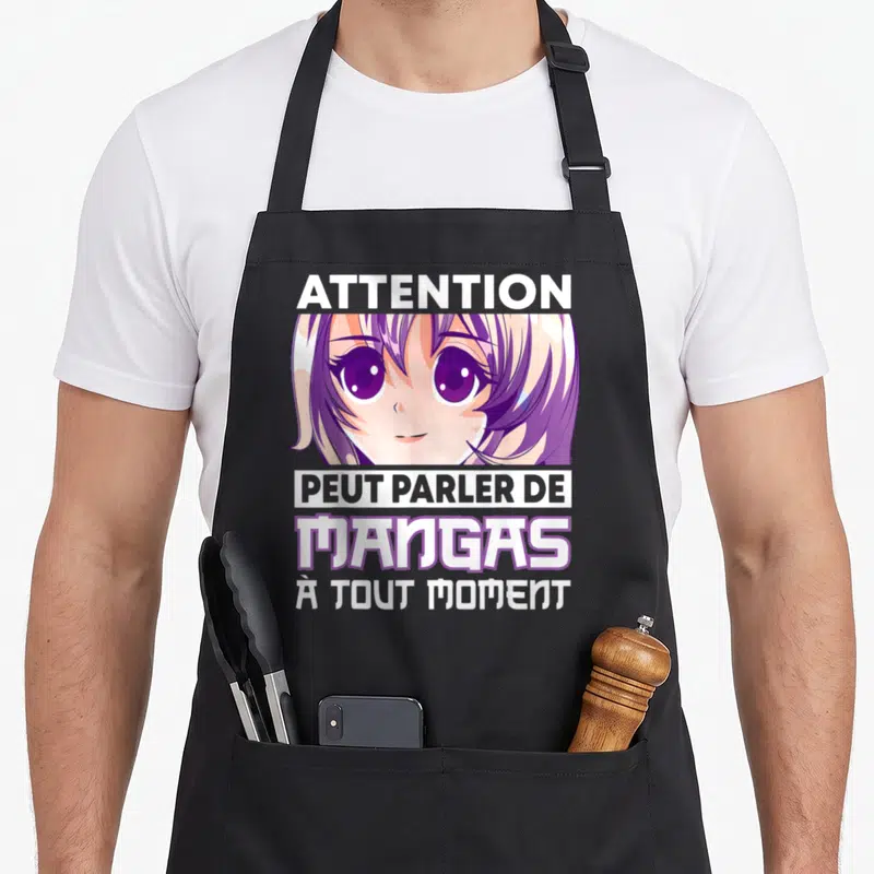 Tablier de cuisine noir avec illustration anime et texte blanc sur fond gris uni