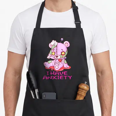 Tablier de cuisine noir avec ours kawaii rose et vert piqué d'aiguilles et texte I Have Anxiety.