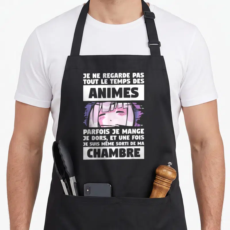 Tablier de cuisine noir avec une illustration de fille aux cheveux roses et un texte humoristique sur les animes.