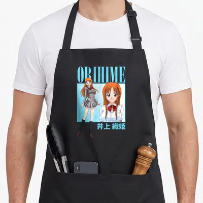 Tablier de cuisine noir avec illustration d'Orihime Inoue et texte bleu style années 90