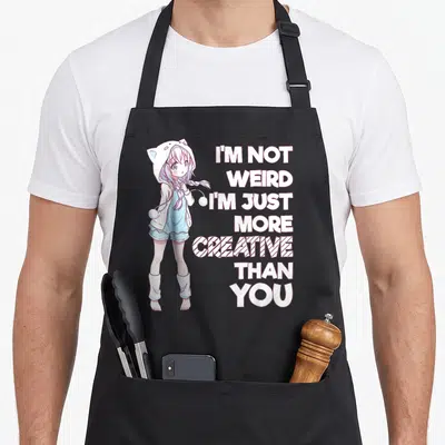 Tablier de cuisine noir avec une illustration anime et le texte I'm Not Weird I'm Just More Creative Than You