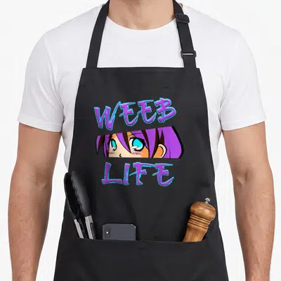 Tablier de cuisine noir avec le texte Weeb Life et un visage de personnage manga aux cheveux violets et yeux bleus.
