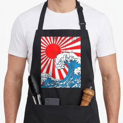 Tablier Kanagawa vague le soleil du Japon — sur un tablier de cuisine noir, fond blanc