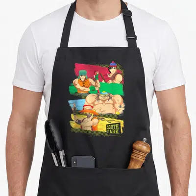 Tablier de cuisine noir avec quatre personnages de South Park en combattants de rue musclés sur fonds colorés.