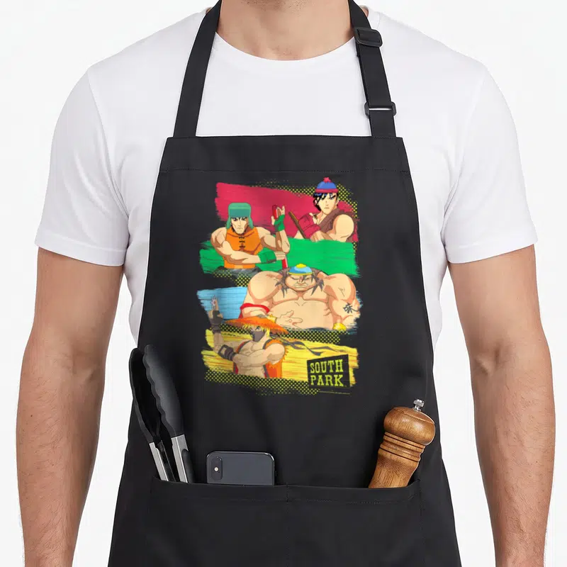 Tablier de cuisine noir avec quatre personnages de South Park en combattants de rue musclés sur fonds colorés.