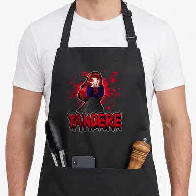 Tablier de cuisine noir avec une illustration yandere et le texte YANDERE en rouge sanglant.