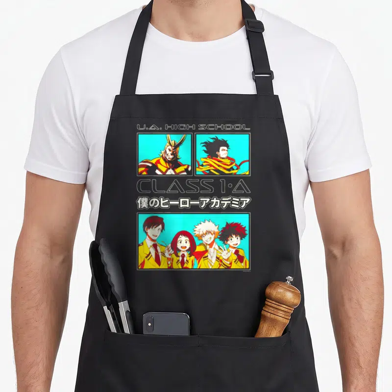 Tablier de cuisine noir avec collage Class 1-A U.A. High School et personnages en uniforme jaune sur fond turquoise.