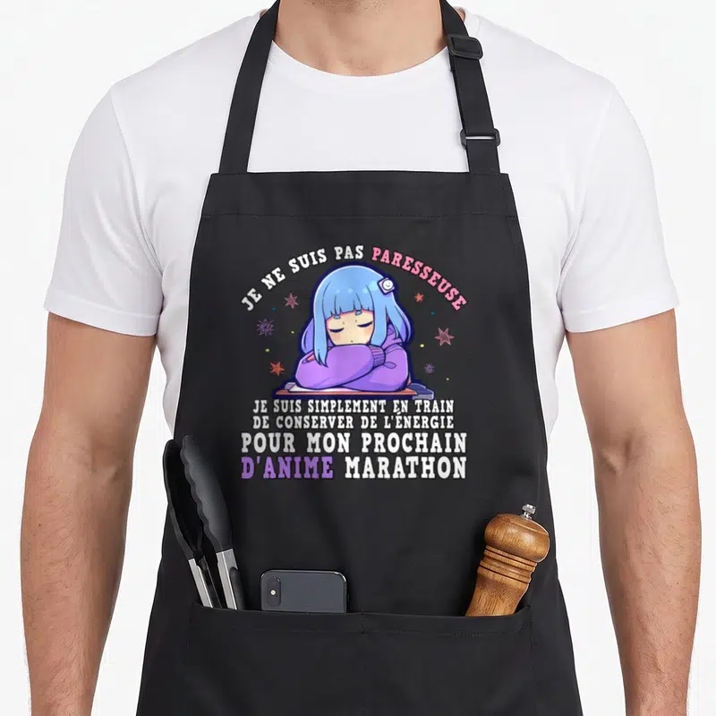 Tablier de cuisine noir avec illustration otaku kawaii bleue et texte humoristique sur les marathons d'anime.