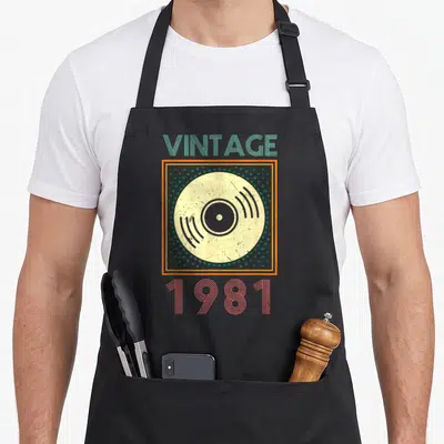 Tablier de cuisine noir avec motif rétro disque vinyle vintage 1981 dans les vins