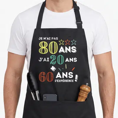 Tablier de cuisine noir avec inscription Je n'ai pas 80 ans j'ai 20 ans plus 60 ans d'expérience et trois étoiles colorées.