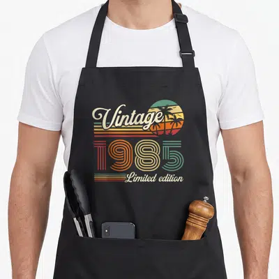 Tablier de cuisine noir avec motif rétroVintage 1985Limited edition et soleil aux palmiers.