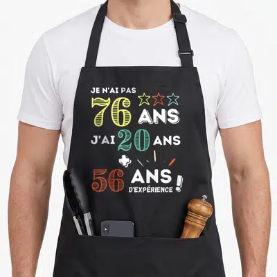 Tablier de cuisine noir avec inscription Je n'ai pas 76 ans j'ai 20 ans plus 56 ans d'expérience et trois étoiles colorées.