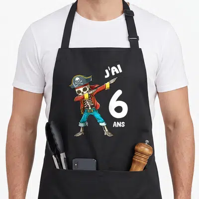 Tablier de cuisine noir avec un squelette pirate en train de faire le dab et l'inscription J'ai 6 ans.