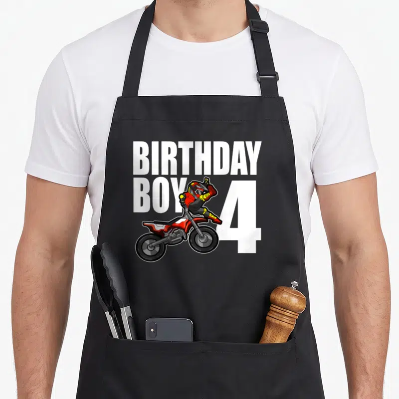 Tablier de cuisine noir avec illustration de moto motocross et texte anniversaire Boy 4 en blanc.