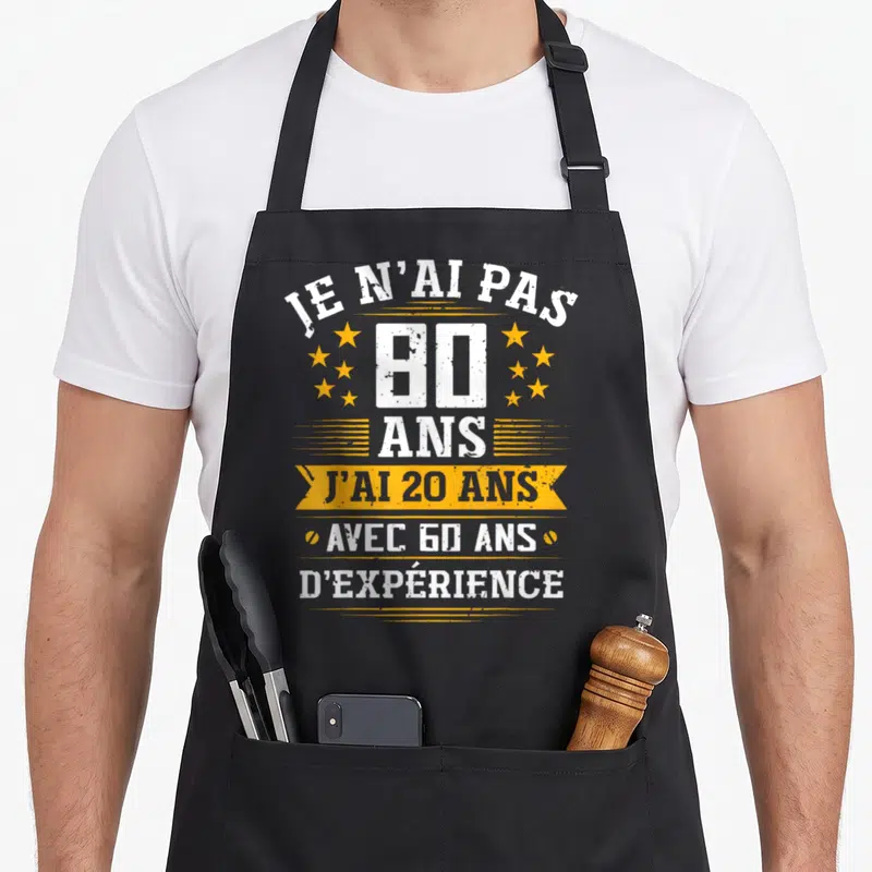 Tablier de cuisine noir avec inscription Je n'ai pas 80 ans j'ai 20 ans avec 60 ans d'expérience et étoiles jaunes.