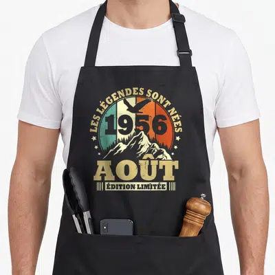 Tablier de cuisine noir avec motif circulaire aux couleurs vert blanc orange, aigle en vol et inscriptions dorées.