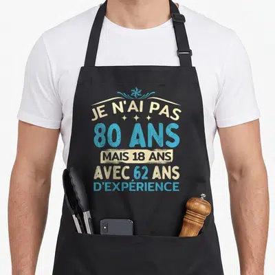 Tablier de cuisine noir avec inscription Je n'ai pas 80 ans mais 18 ans avec 62 ans d'expérience en bleu et beige.