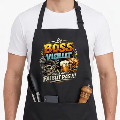 Tablier de cuisine noir avec illustration Le Boss Vieillit mais ne Faiblit Pas, crâne et bière.