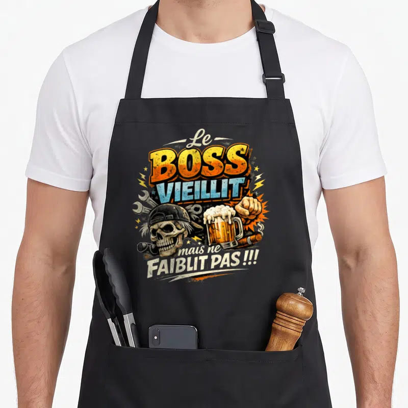 Tablier de cuisine noir avec illustration Le Boss Vieillit mais ne Faiblit Pas, crâne et bière.
