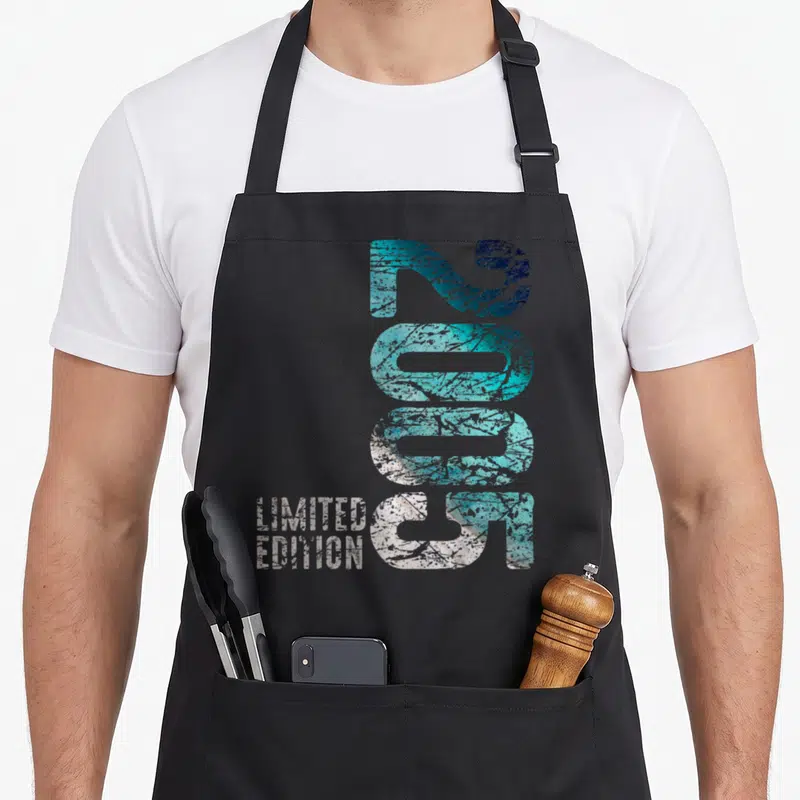 Tablier de cuisine noir avec inscription 2005 Limited Edition en turquoise et blanc effet dégradé.