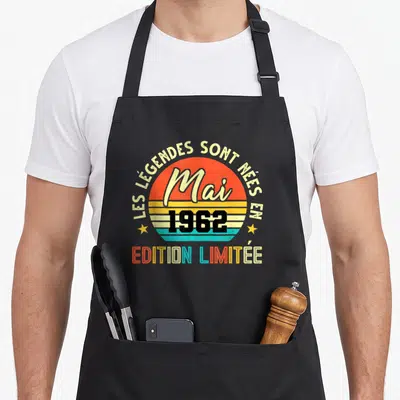 Tablier de cuisine noir avec motif circulaire retro orange jaune bleu et texte Les Legendes sont nees en Mai 1962 Edition Limitée