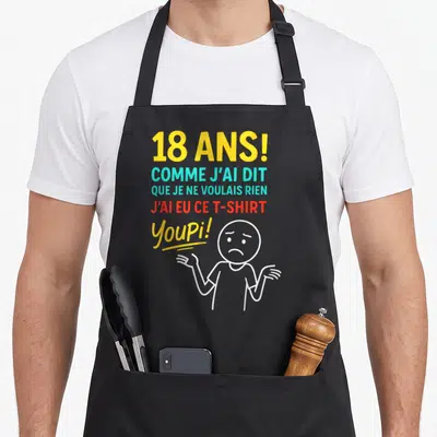 Tablier de cuisine noir avec inscription 18 ans et personnage dessiné aux épaules relevées