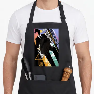 Tablier de cuisine noir avec illustration colorée d'un homme en chapeau et texte Pink Floyd J'aurais aimé que tu sois là