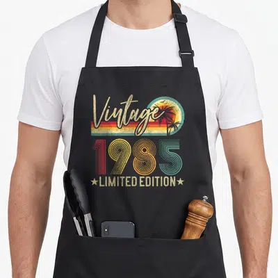 Tablier de cuisine noir avec motif vintage 1985 Limited Edition palmiers et soleil retro