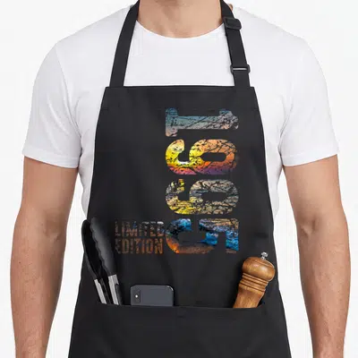 Tablier de cuisine noir avec les chiffres 31 en dégradé couleur et l'inscription limited edition en bas à gauche.