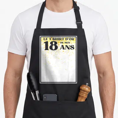 Tablier de cuisine noir avec motif blanc et or mentionnant le « Tshirt » d'or de mes 18 ans et des paillettes dorées.