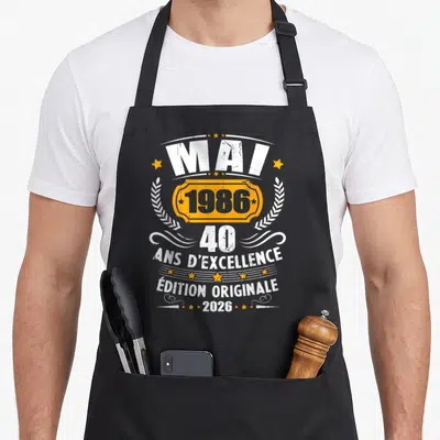 Tablier de cuisine noir avec inscription vintage Mai 1986 40 ans d'excellence édition originale 2026 entouré d'étoiles dorées.