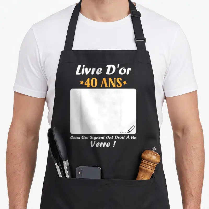 Tablier de cuisine noir avec inscription Livre D'or 40 ans et zone blanche à signer par les invités.