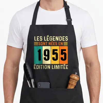 Tablier de cuisine noir avec inscription Les Légendes sont nées en 1955 sur bandes colorées vintage