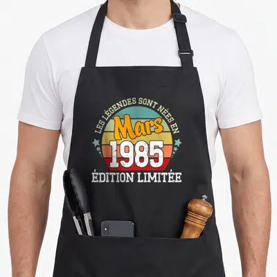 Tablier de cuisine noir avec motif circulaire retro Les Légendes Sont Nées en Mars 1985 « Édition Limitée »