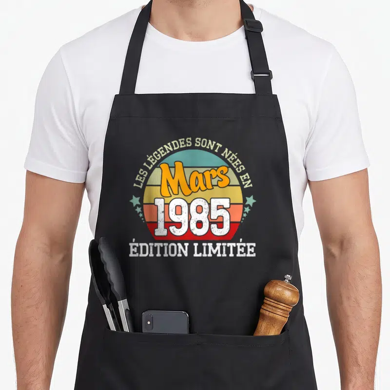 Tablier de cuisine noir avec motif circulaire retro Les Légendes Sont Nées en Mars 1985 « Édition Limitée »