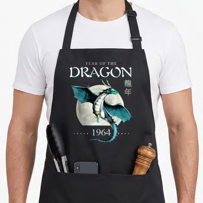 Tablier de cuisine noir avec un dragon chinois bleu devant une lune et le texte Year of the Dragon 1964.