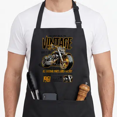 Tablier de cuisine noir avec illustration de chopper vintage et texte I'm not old, I'm vintage 1961