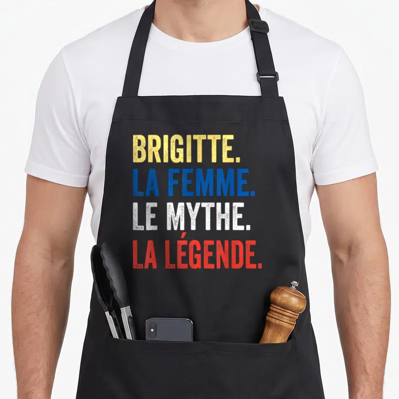 Tablier de cuisine noir avec inscription colorée Brigitte la femme le mythe la légende en lettres capitales.