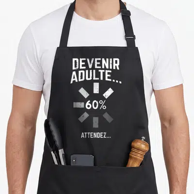 Tablier de cuisine noir avec inscription blanche Devenir Adulte 60% Attendez et graphique circulaire.